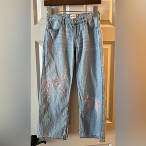 Girls Abercrombie kid wide leg, embroidered bow jeans.